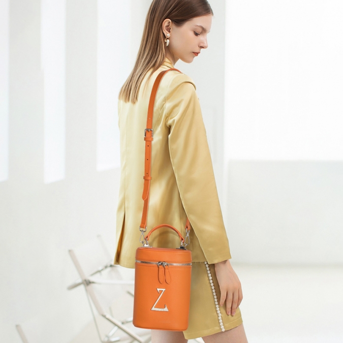 Borsa a secchiello da donna in vera pelle color arancione 2021 con logo personalizzato 
